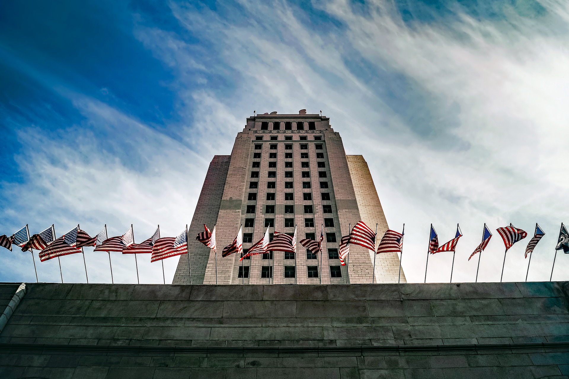 Illustrative: government office building with flags flying